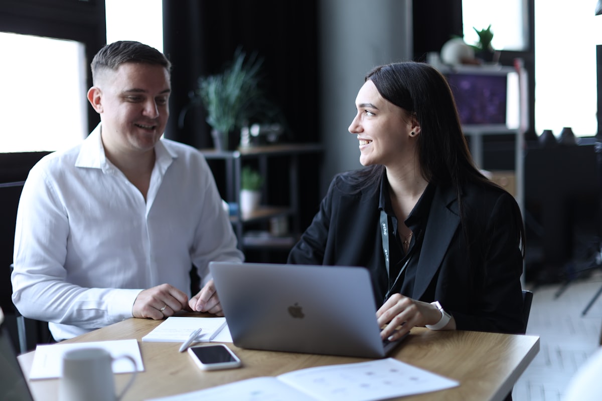 Two professionals in a working discussion